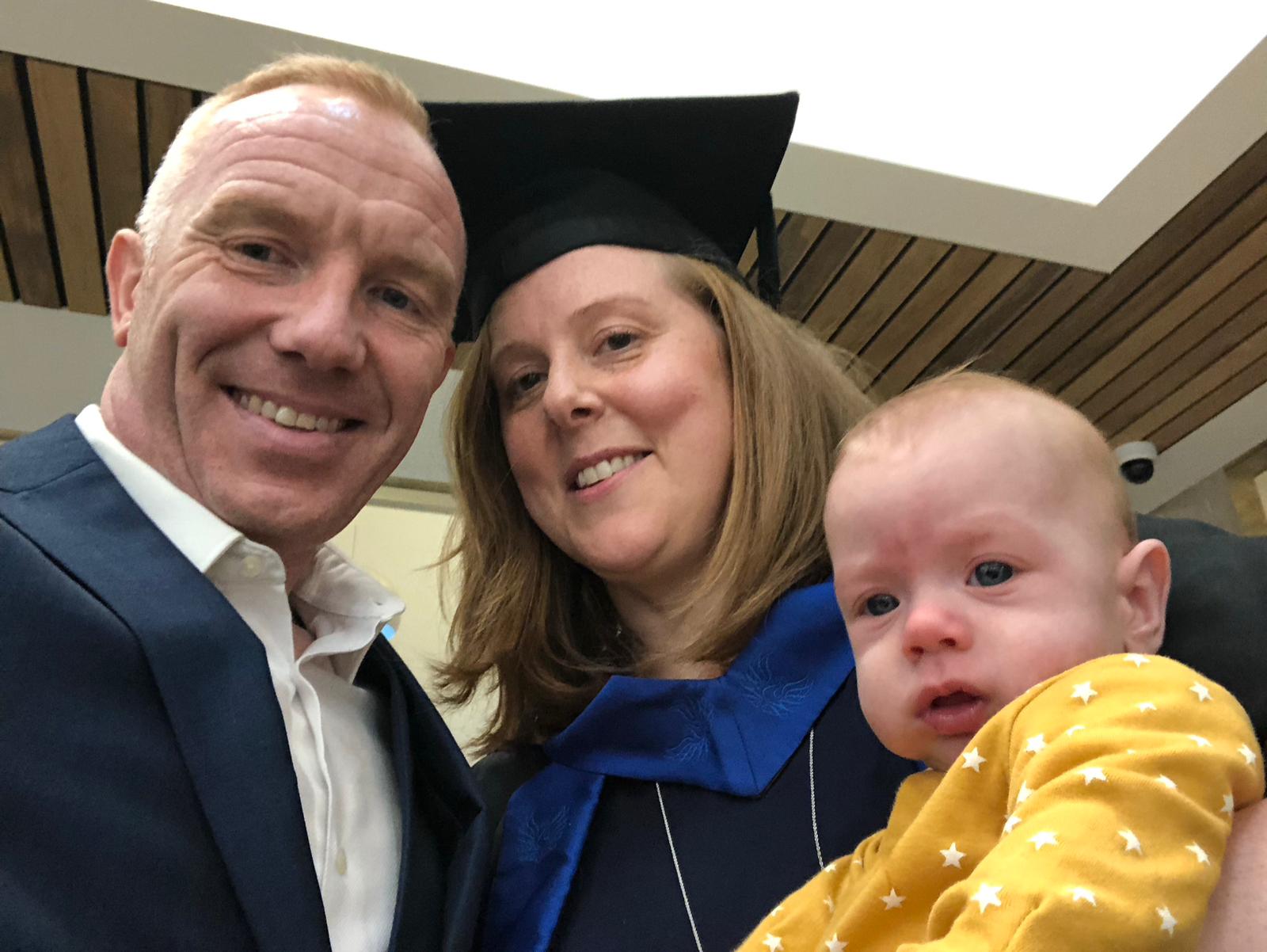 Si and Kim with their son at her graduation